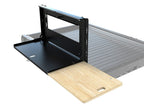 Table rabattable pour plateau coulissant de benne