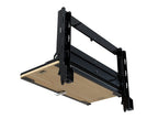 Table rabattable pour plateau coulissant de benne